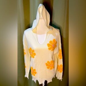 Super cuter cream colored Hazel Moon sweater with yellow and pink flowers.